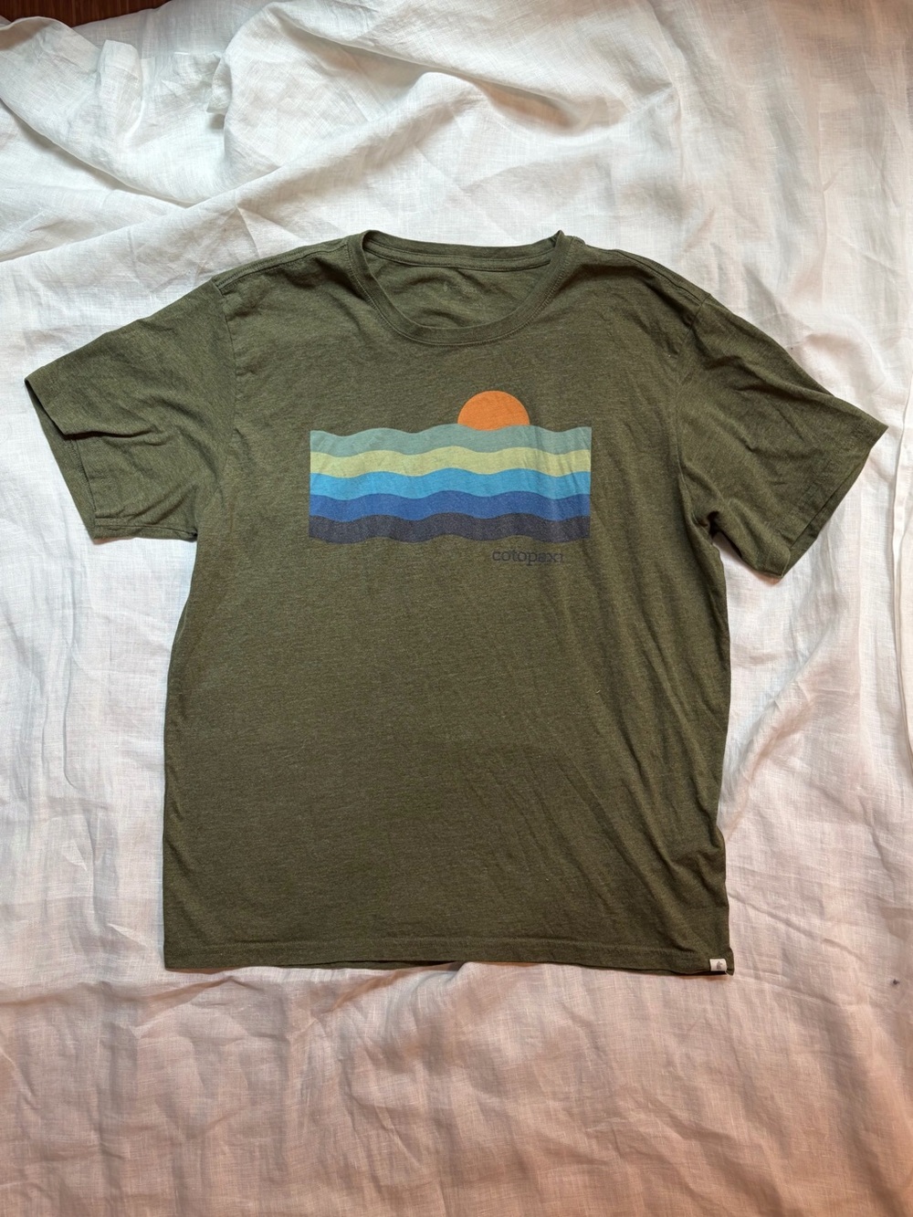 cotopaxi Olive Green Short Sleeve Tee with Sunset Wave Graphic